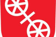 Das ist das Wappen der Stadt Mainz, ein weißes Rad auf rotem Hintergrund