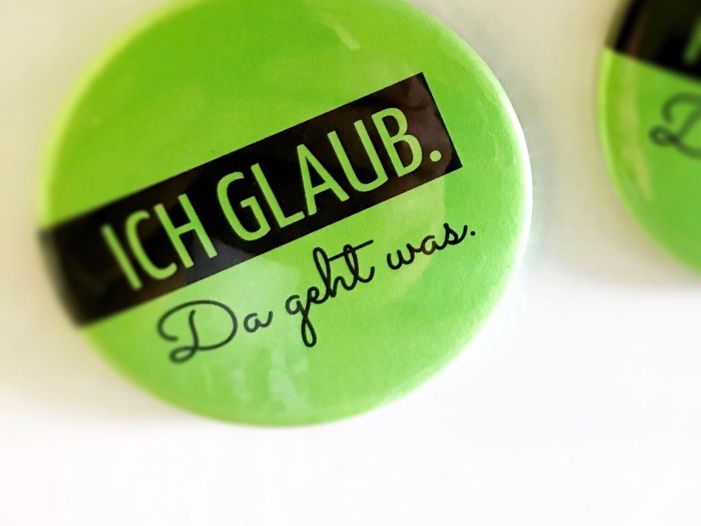 Button, auf dem das Motto des BDKj 'Ich glaube. Da geht was!' steht.
