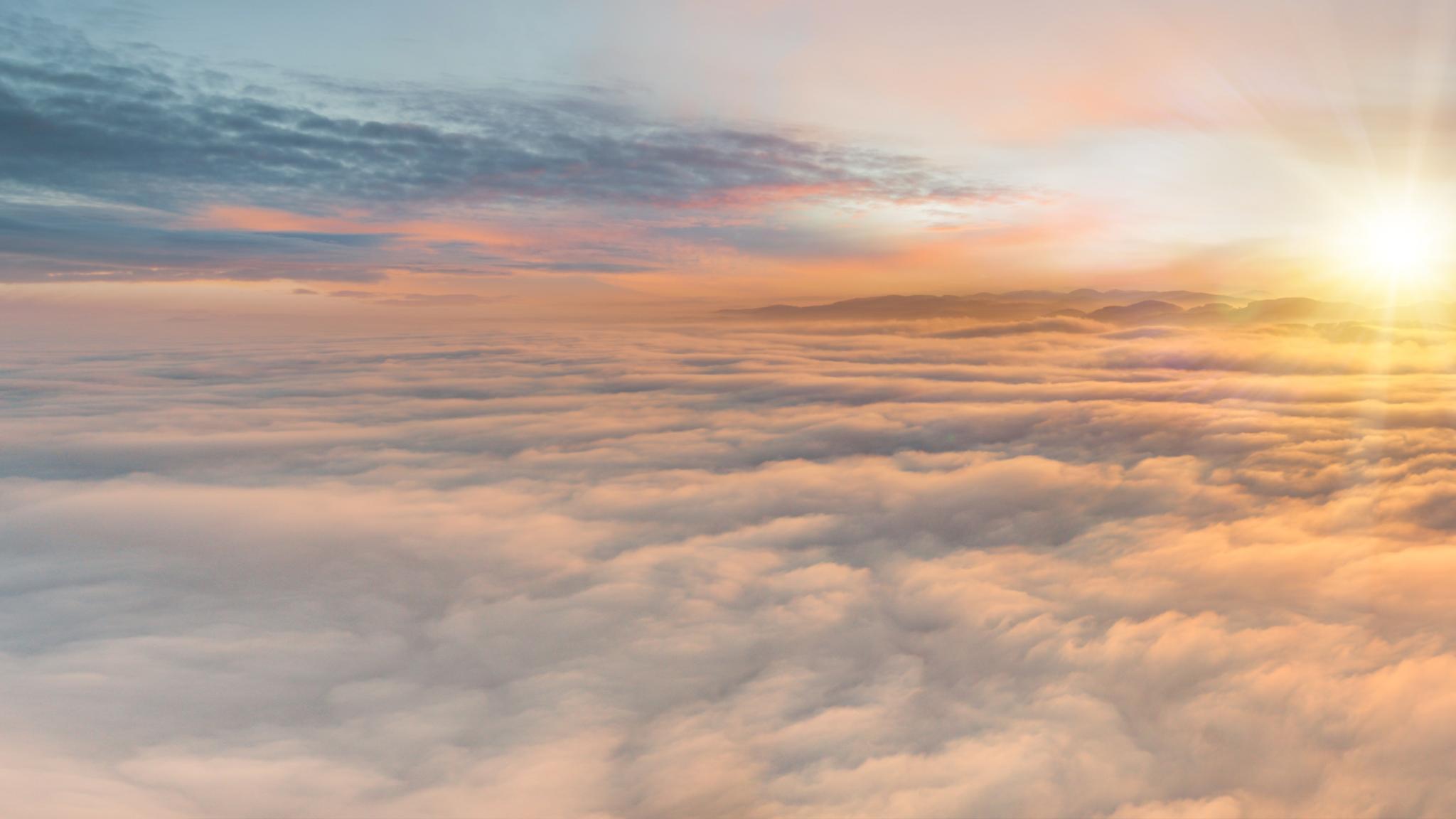 Sunset sky with beautiful clouds from the airplane window