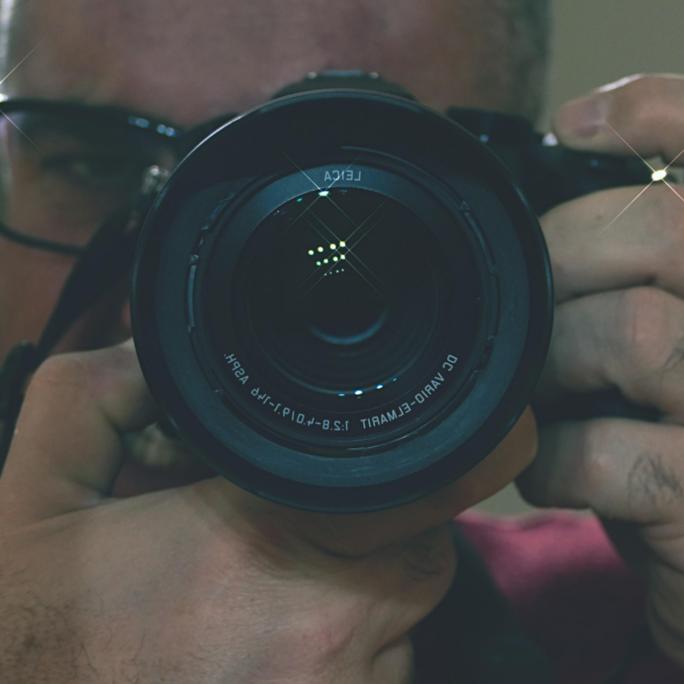 Mensch mit Fotoapparat