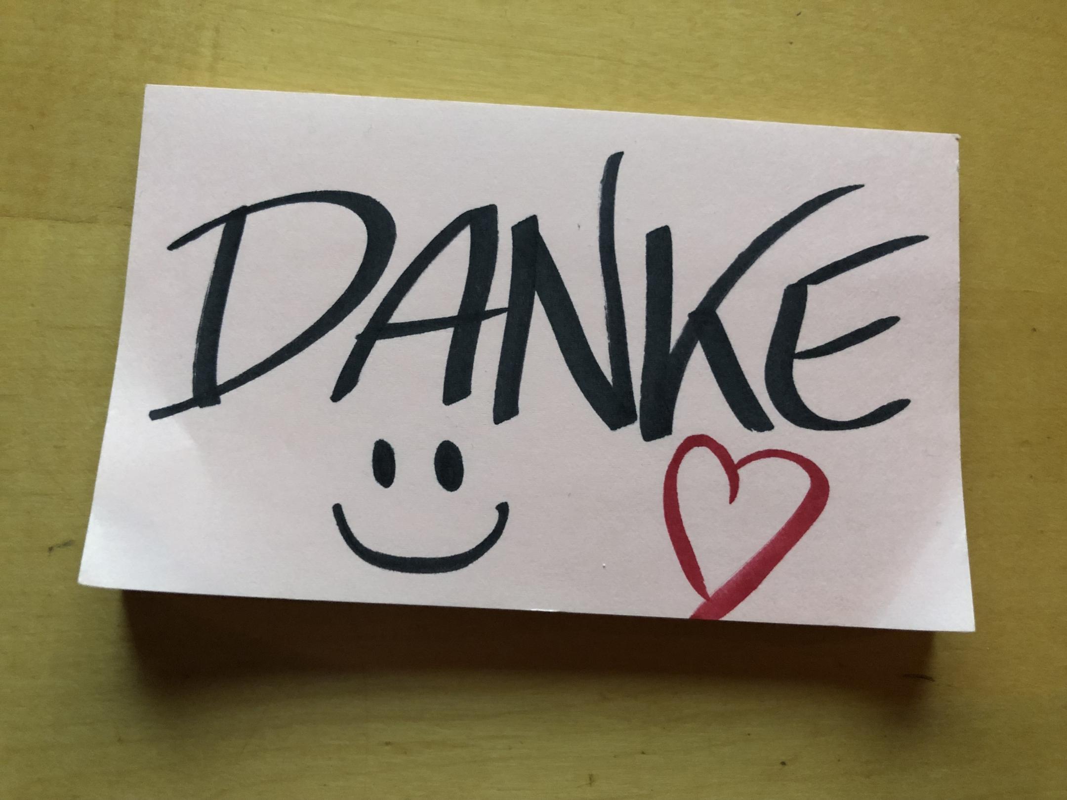 Post-it-Notiz mit Danke und Smiley