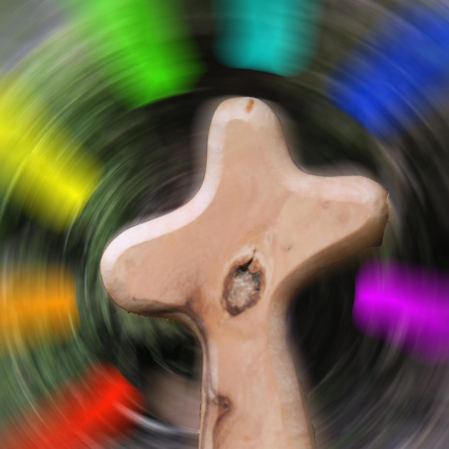 Kreuz vor diffusem Farbhintergrund