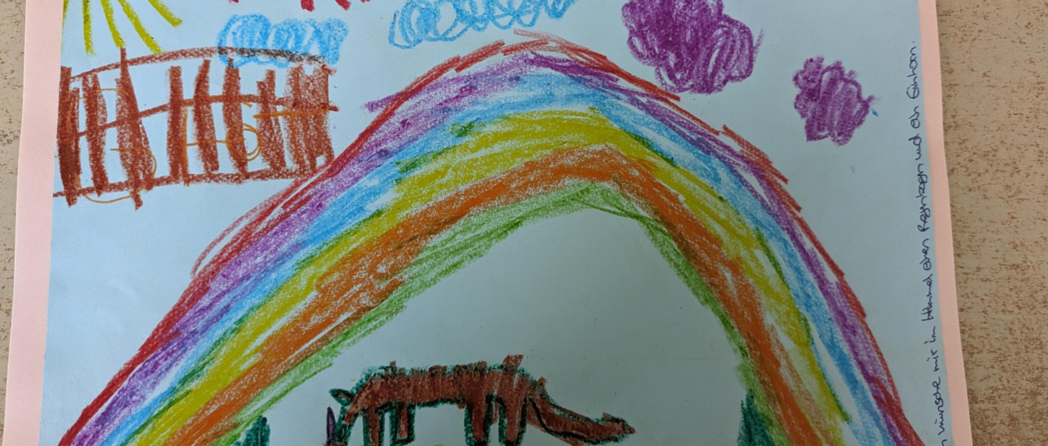 einen Regenbogen und ein Einhorn