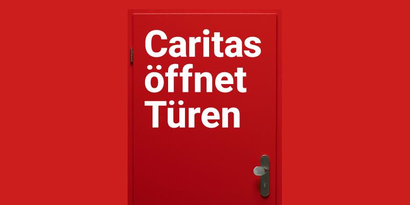 Rote Tür mit Aufschrift 'Caritas öffnet Türen'
